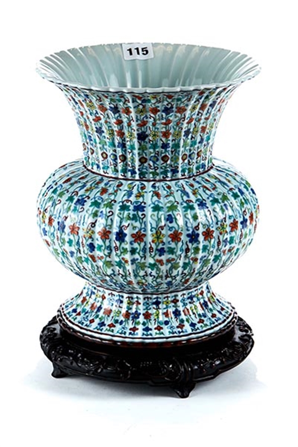 A Chinese ribbed porcelain Doucai style vase